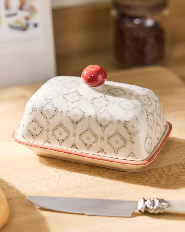 Beurrier à motifs orange coucher de soleil et losanges