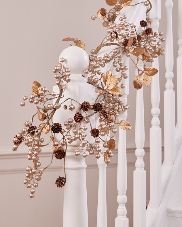 gold berry christmas garland on banister