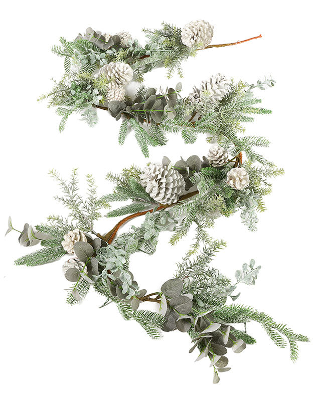 white pine cone and green christmas garland