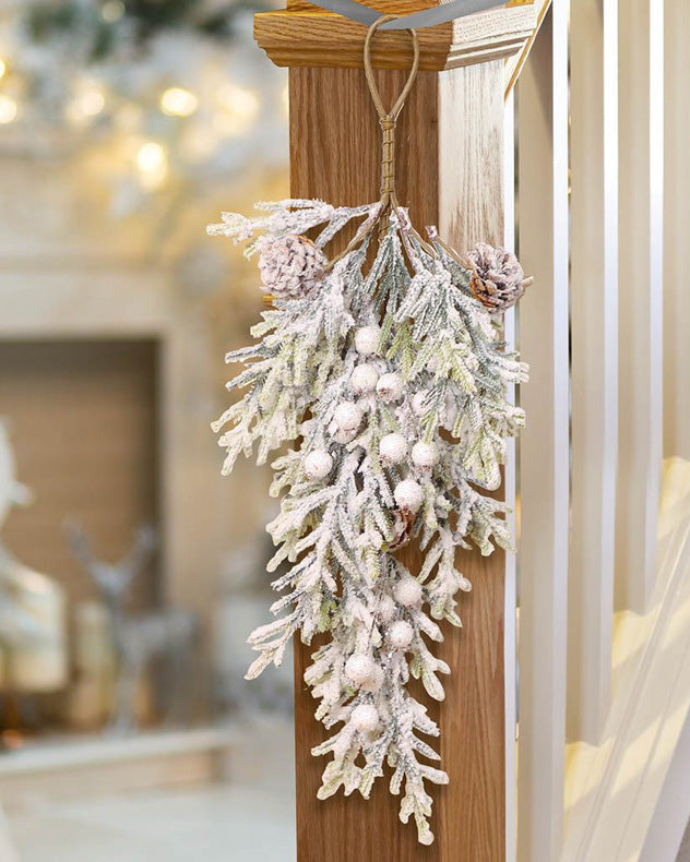 snowy christmas swag decoration on banister