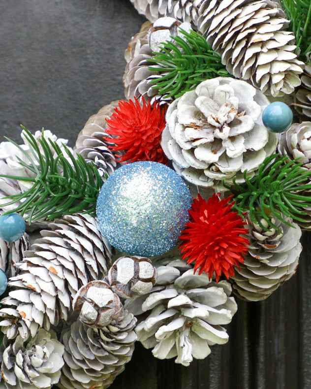 ice blue sparkle bauble and white pinecone door wreath