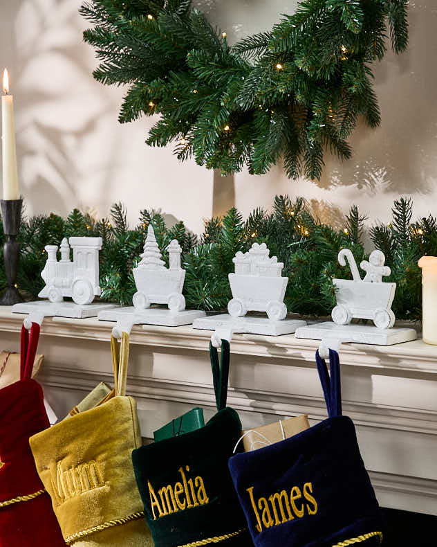 White Recycled Iron Stocking Holders - White Family of 4 Train Christmas Stocking Holder Set