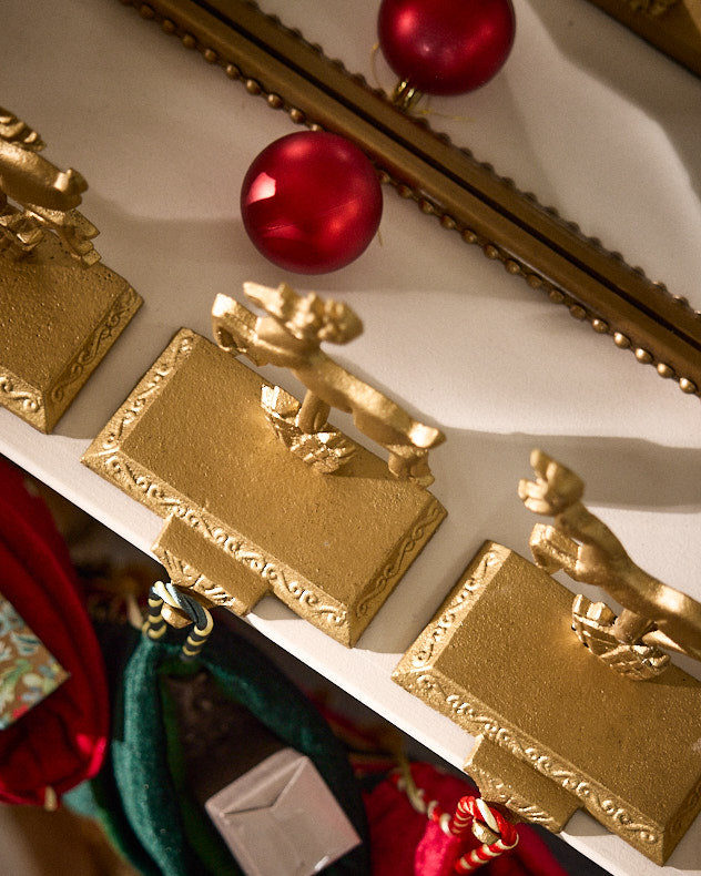 Santa's Sleigh Set of 4 Gold Stocking Holders