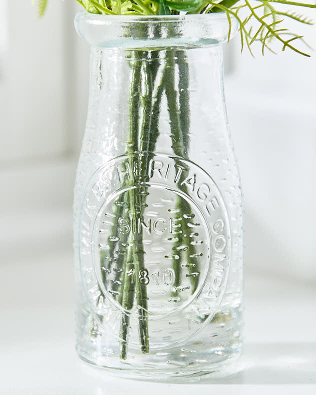 Buttercup Floral Spring Houseplant in Bottle Vase