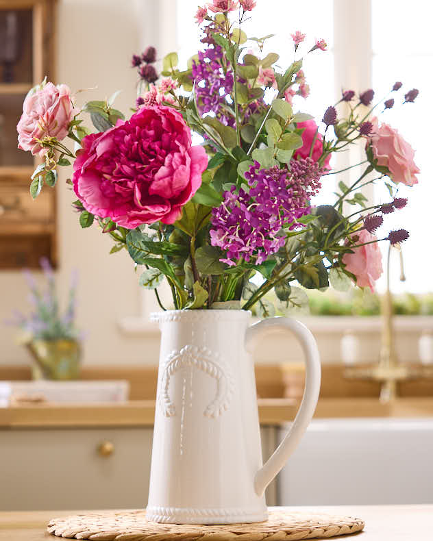 Artificial Spring Blooms in Jug Vase