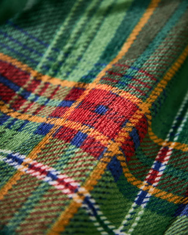 Grüne karierte Tagesdecke