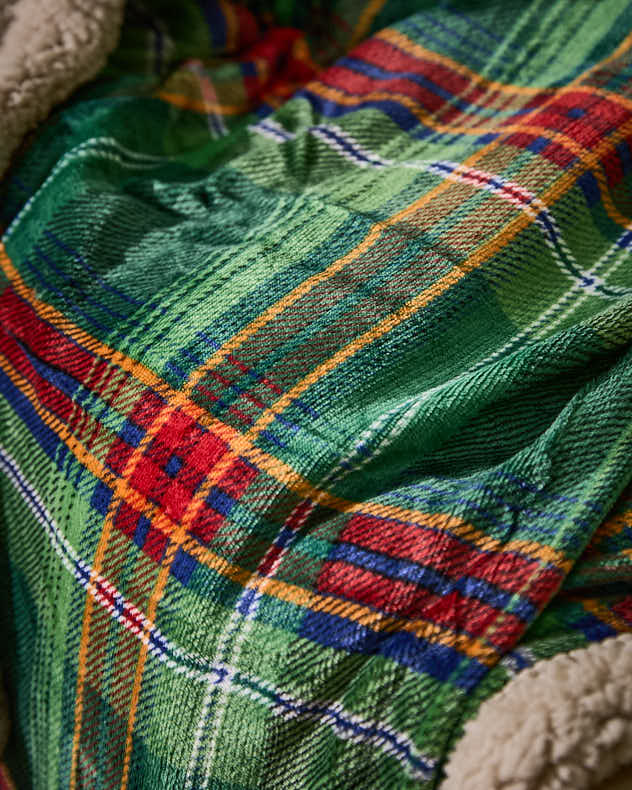 Grüne karierte Tagesdecke