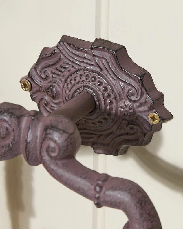 Cast iron toilet roll holder closeup