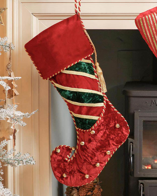 velvet red christmas stocking on mantle