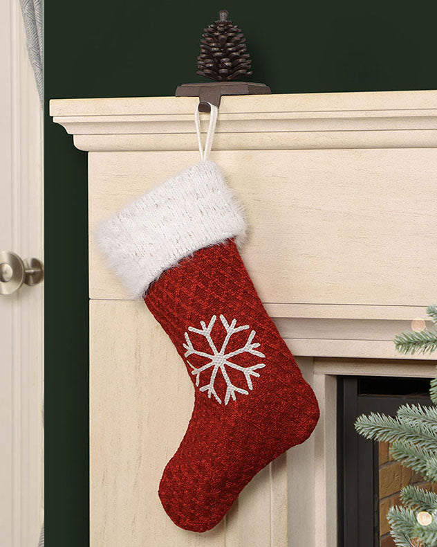 traditional red white stocking hanging from mantle