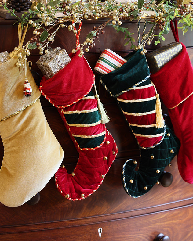 velvet christmas stockings on mantle