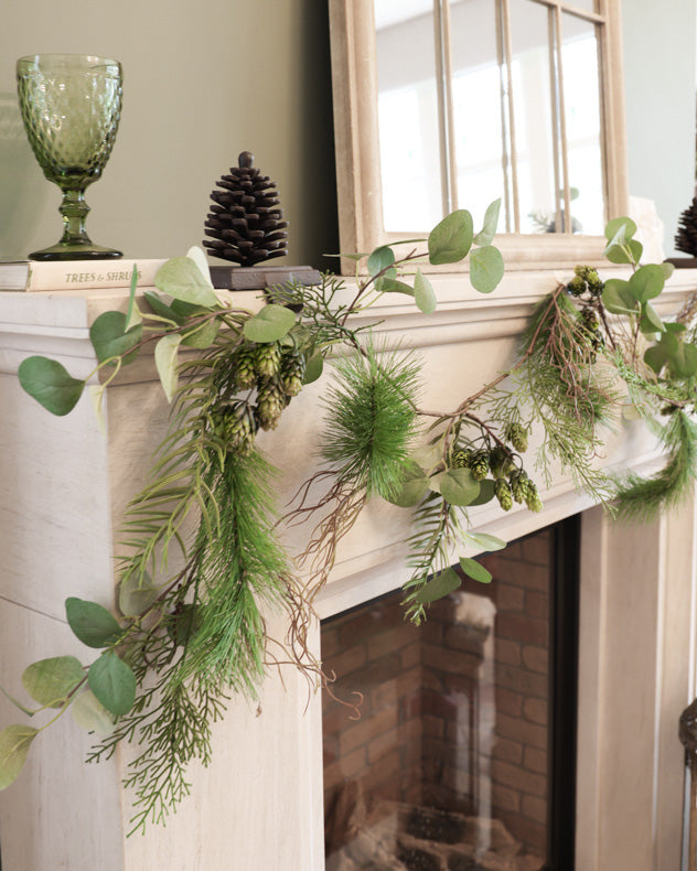 green christmas garland on mantle