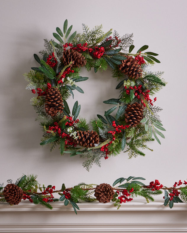 red berry and large pinecone christmas wreath and garland