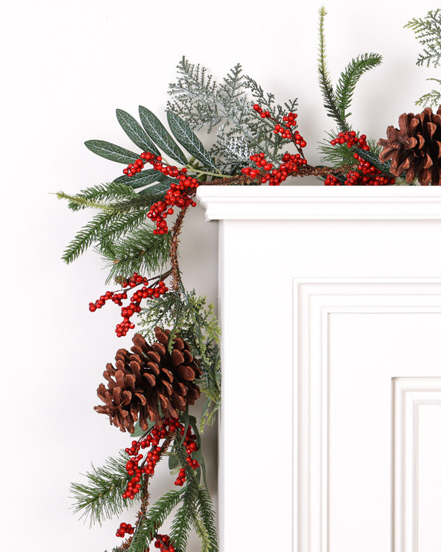 pinecone red berry garland on mantle