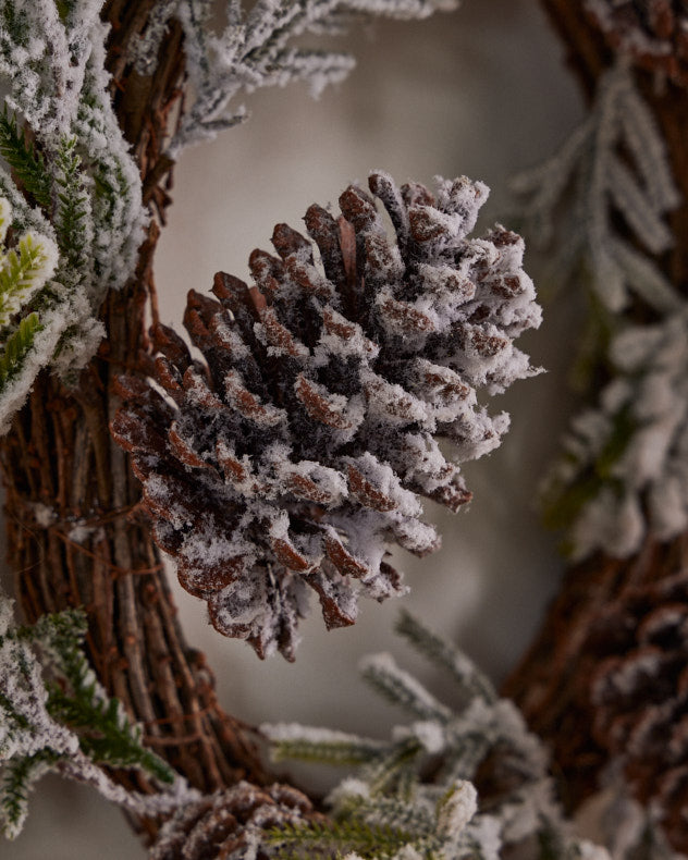 snow-dusted pinecone wreath