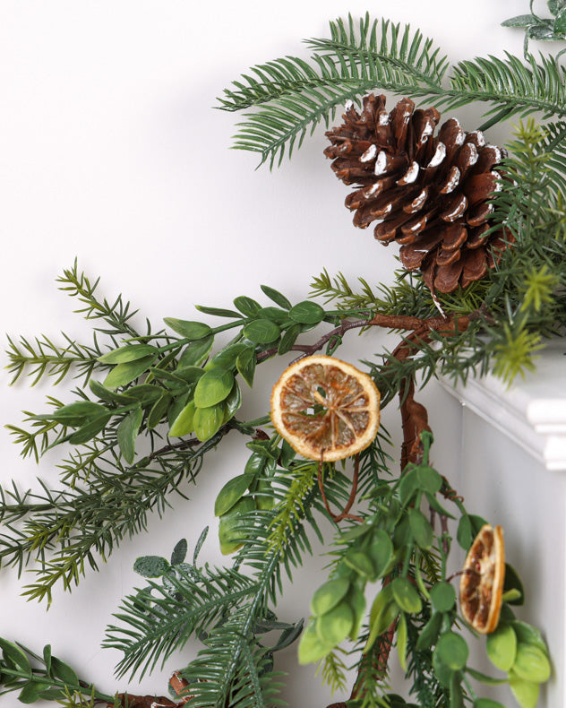 christmas pinecone garland on mantle