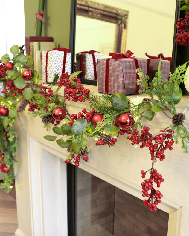red green christmas garland on mantle
