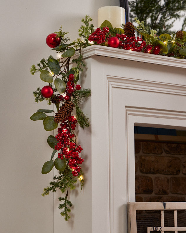 red berry and bauble garland on mantle