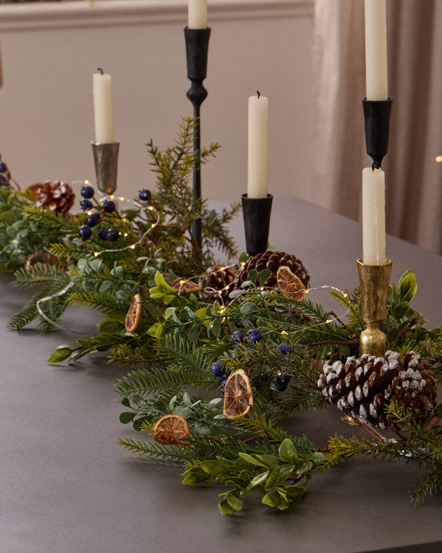 dining table with christmas garland centrepiece