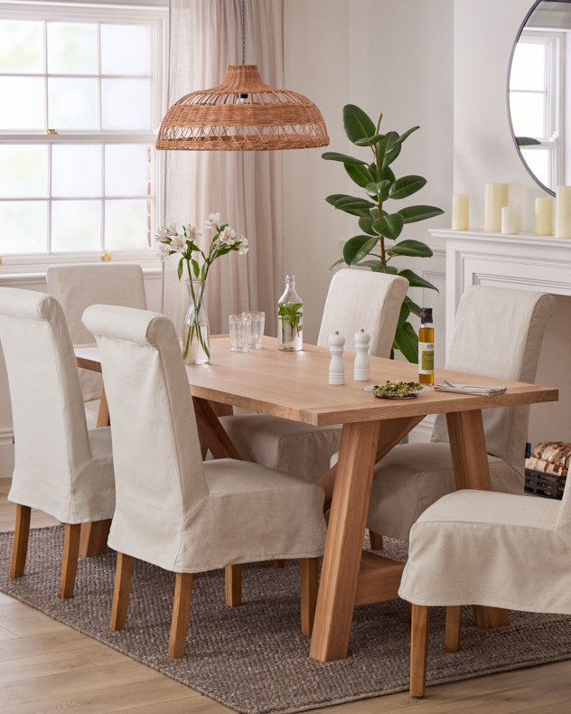 solid oak dining room table with cream fabric dining room chairs
