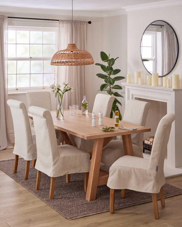 solid oak dining table with cream fabric dining chairs