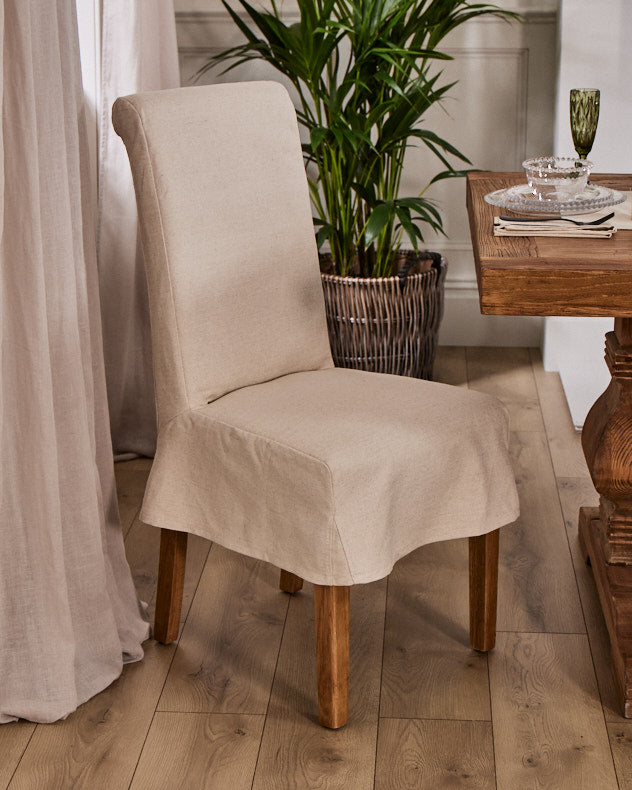cream dining room chair with chair cover