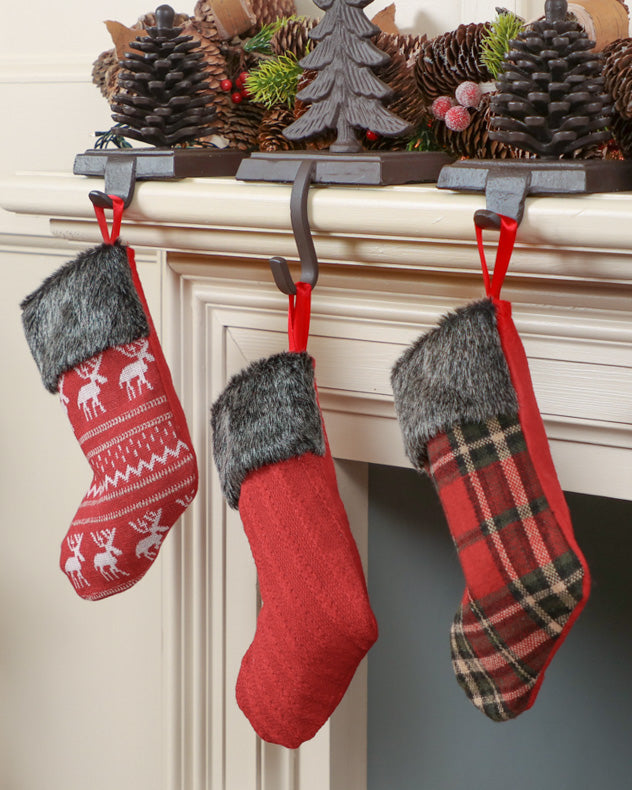 mini stockings hanging on mantle