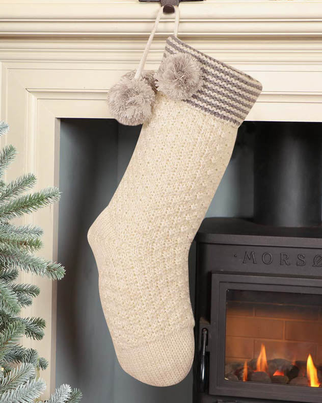 White knitted stocking on Fireplace