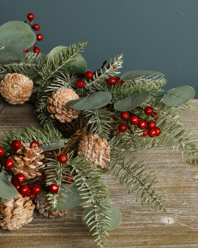 christmas wreath with pinecones and red berries
