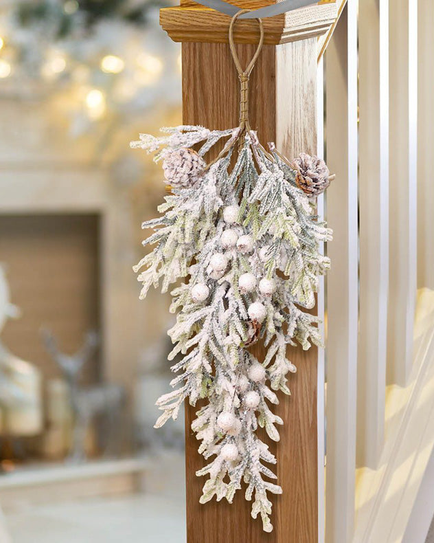 snowy christmas swag decoration on banister